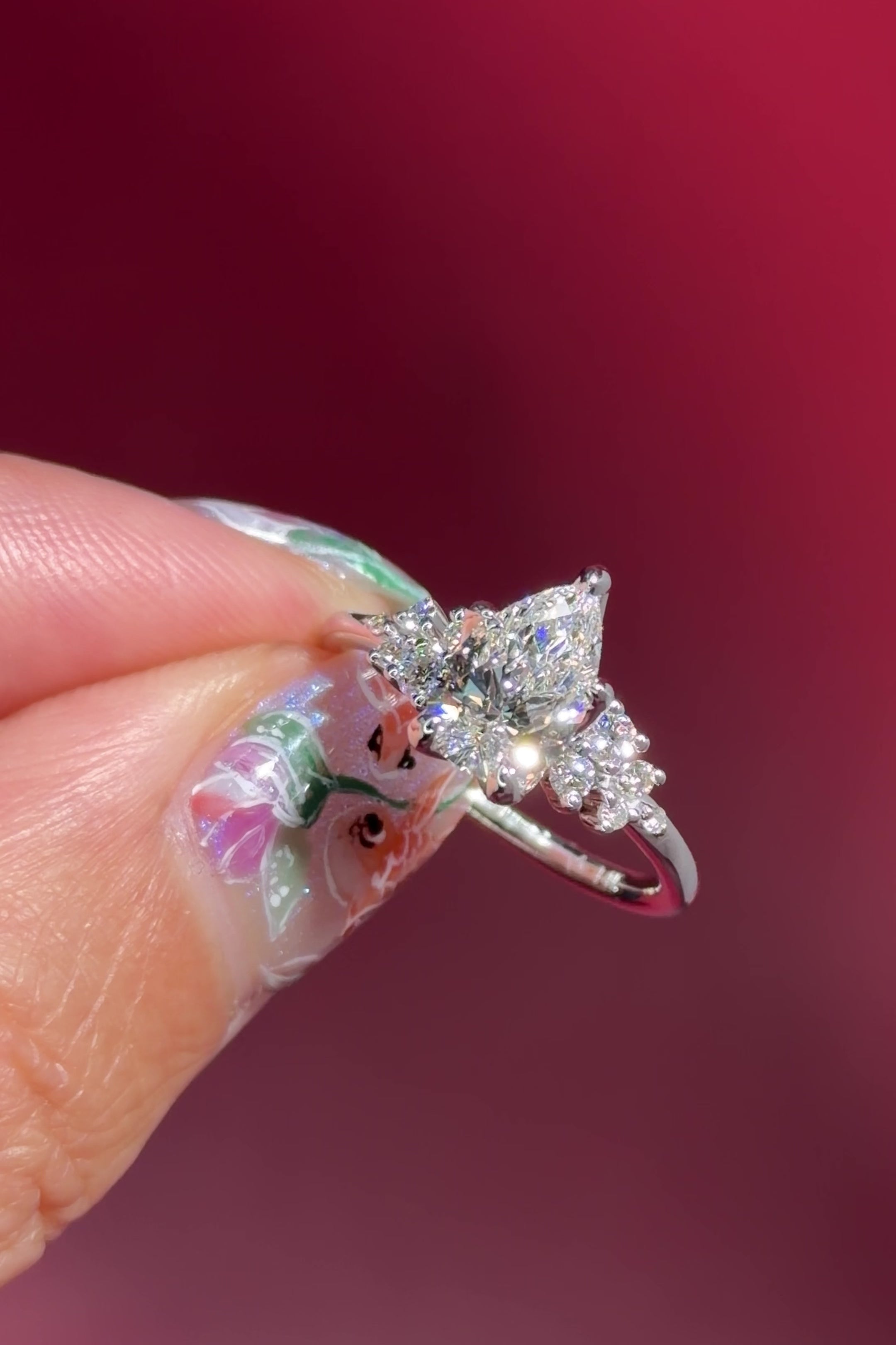 pear lab diamond cluster white gold nature inspired engagement ring with petal prong basket