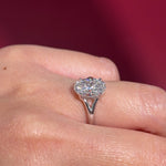 oval lab diamond white gold solitaire split shank engagement ring on hand
