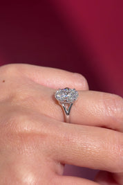 oval lab diamond white gold solitaire split shank engagement ring on hand