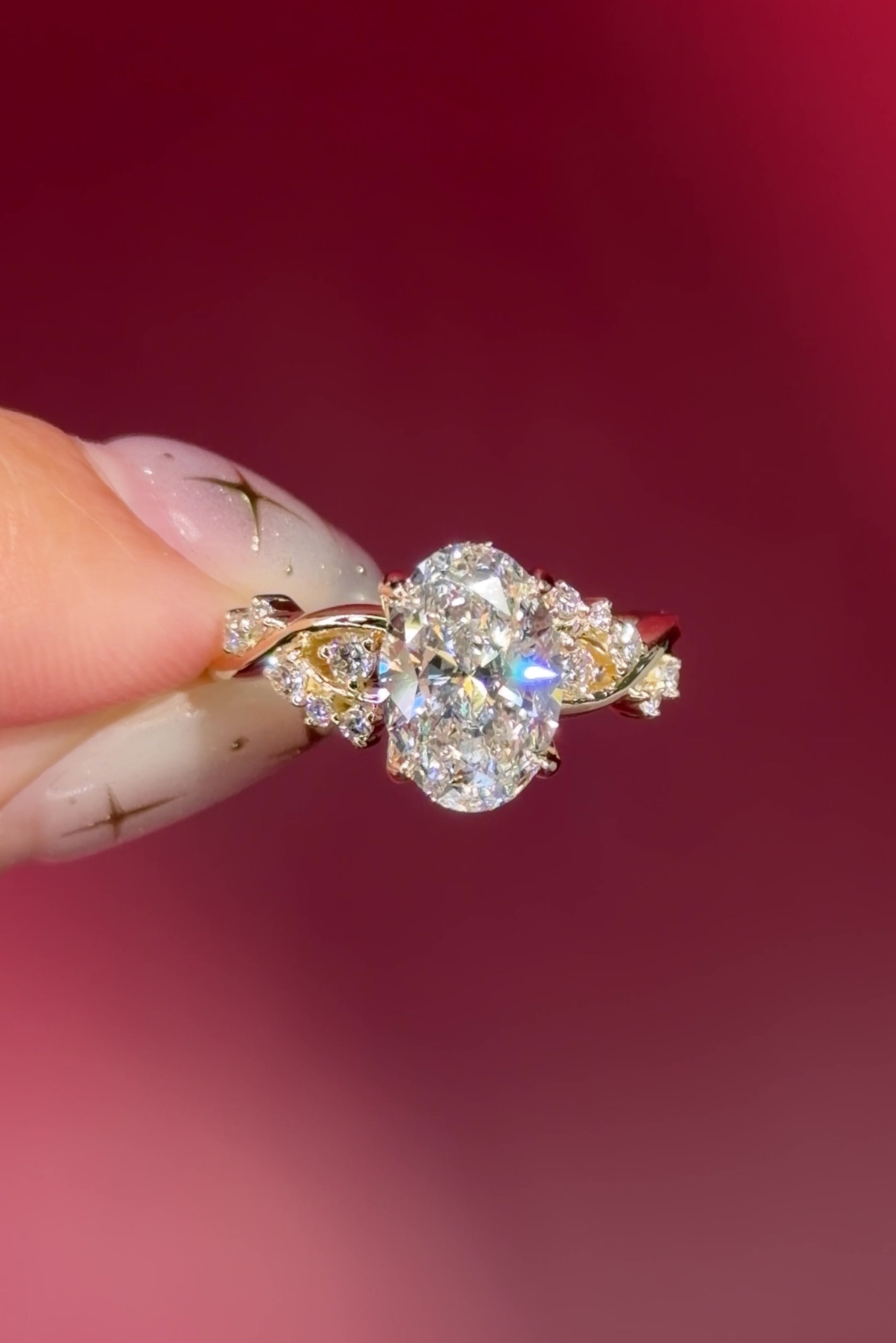 oval lab diamond cluster side stones whimsical yellow gold engagement ring