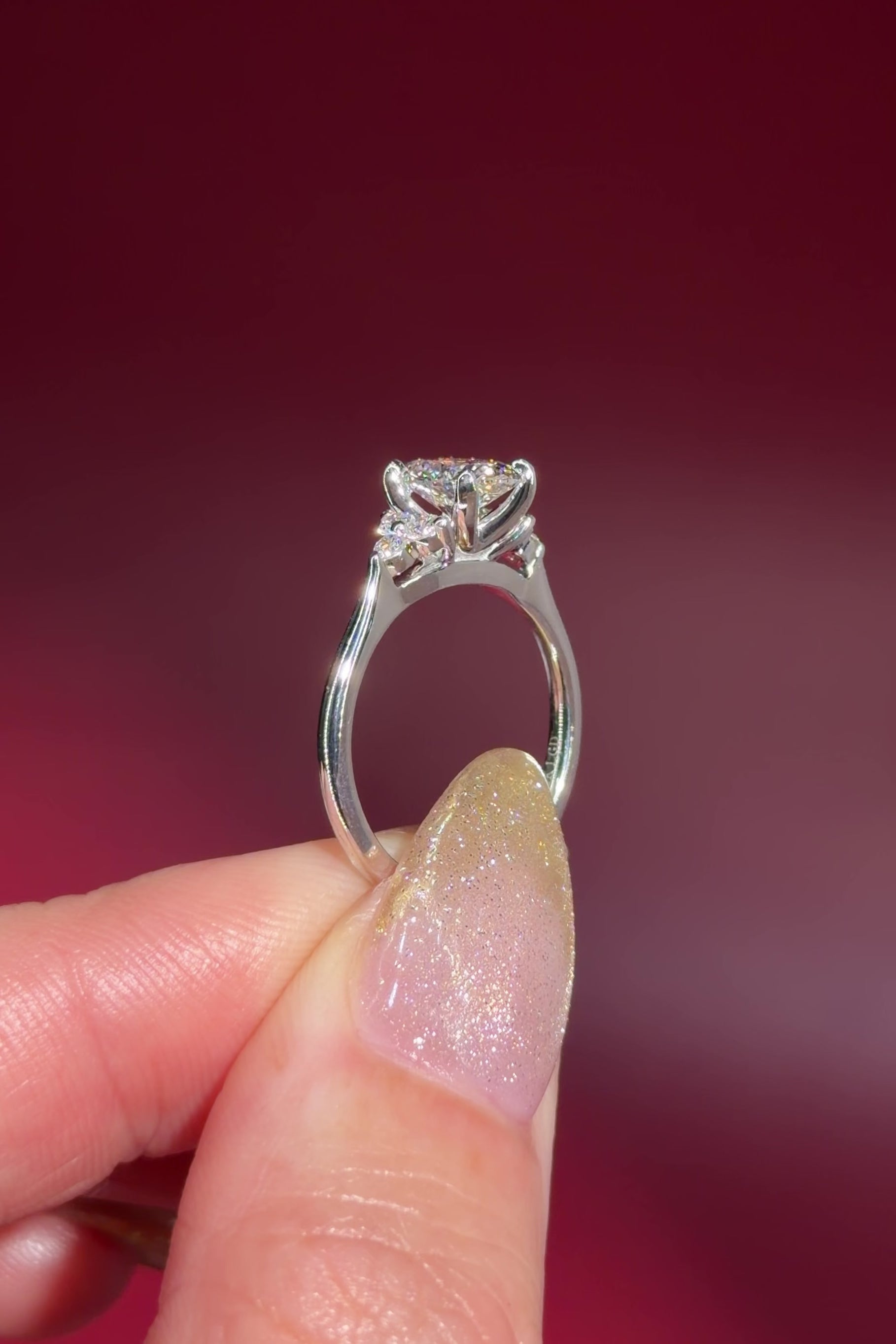 1.01ct D-VS1 Oval Lab Diamond Lindsey. The Lindsey features a classic high polish band with a trio of diamond side stones to perfectly accent your selected center stone.