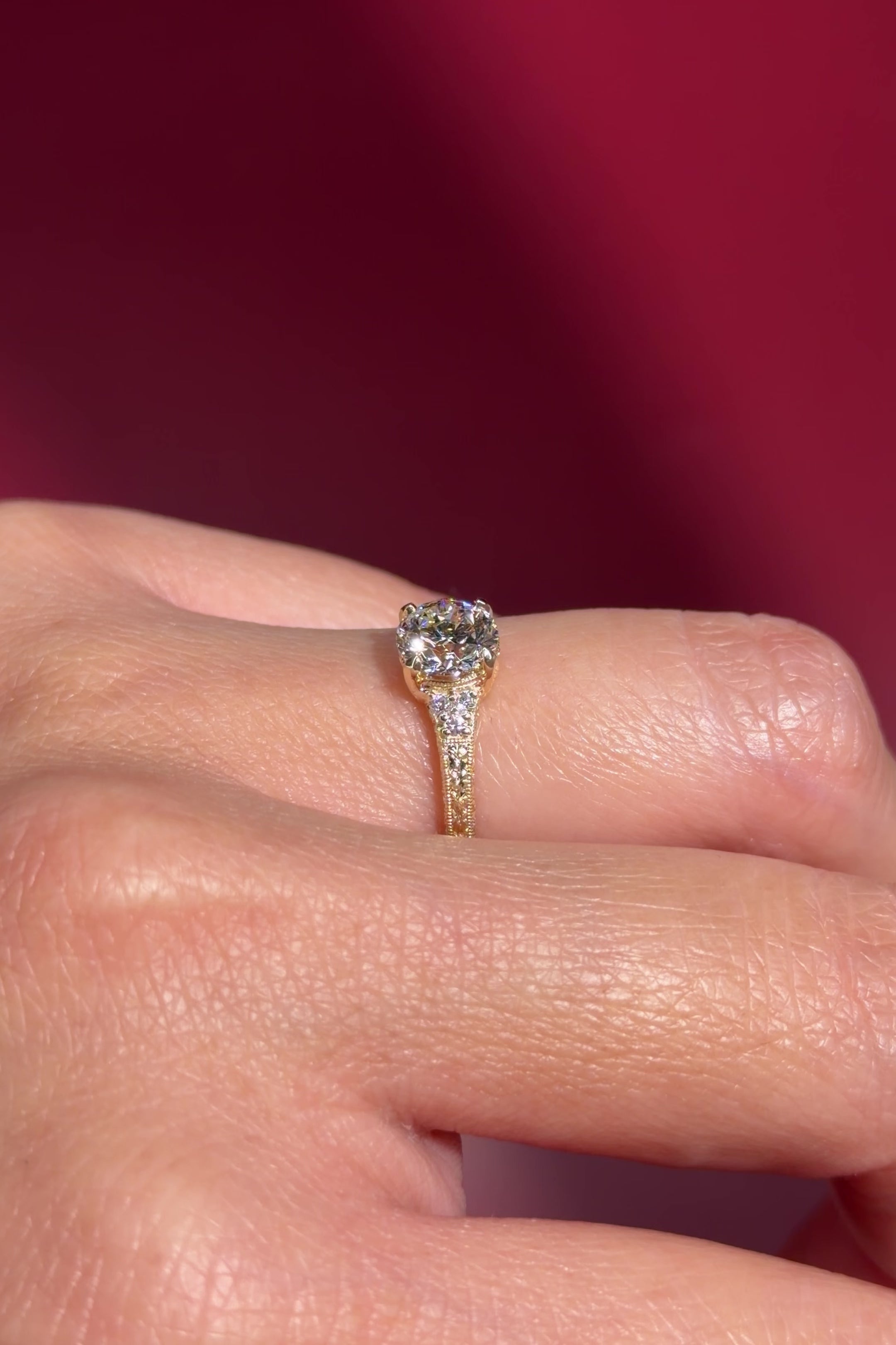 yellow gold round lab diamond vintage hand engraved engagement ring on hand