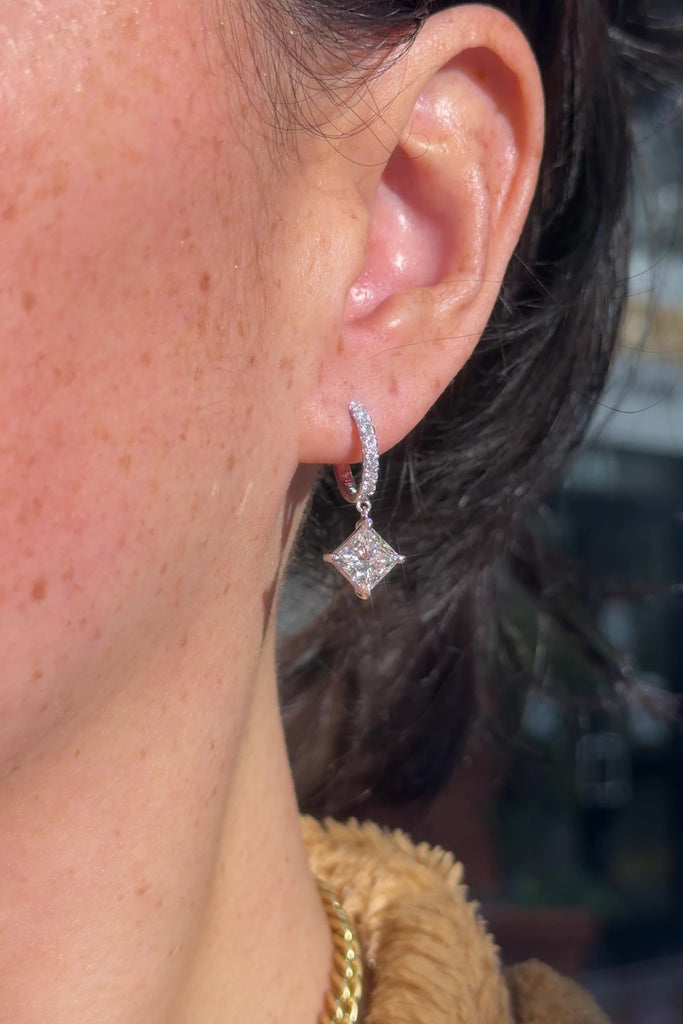 Princess cut Lab Diamond Drop Hoops with pave diamonds in White Gold at princess Bride diamonds jewelry store in huntington beach california on model 