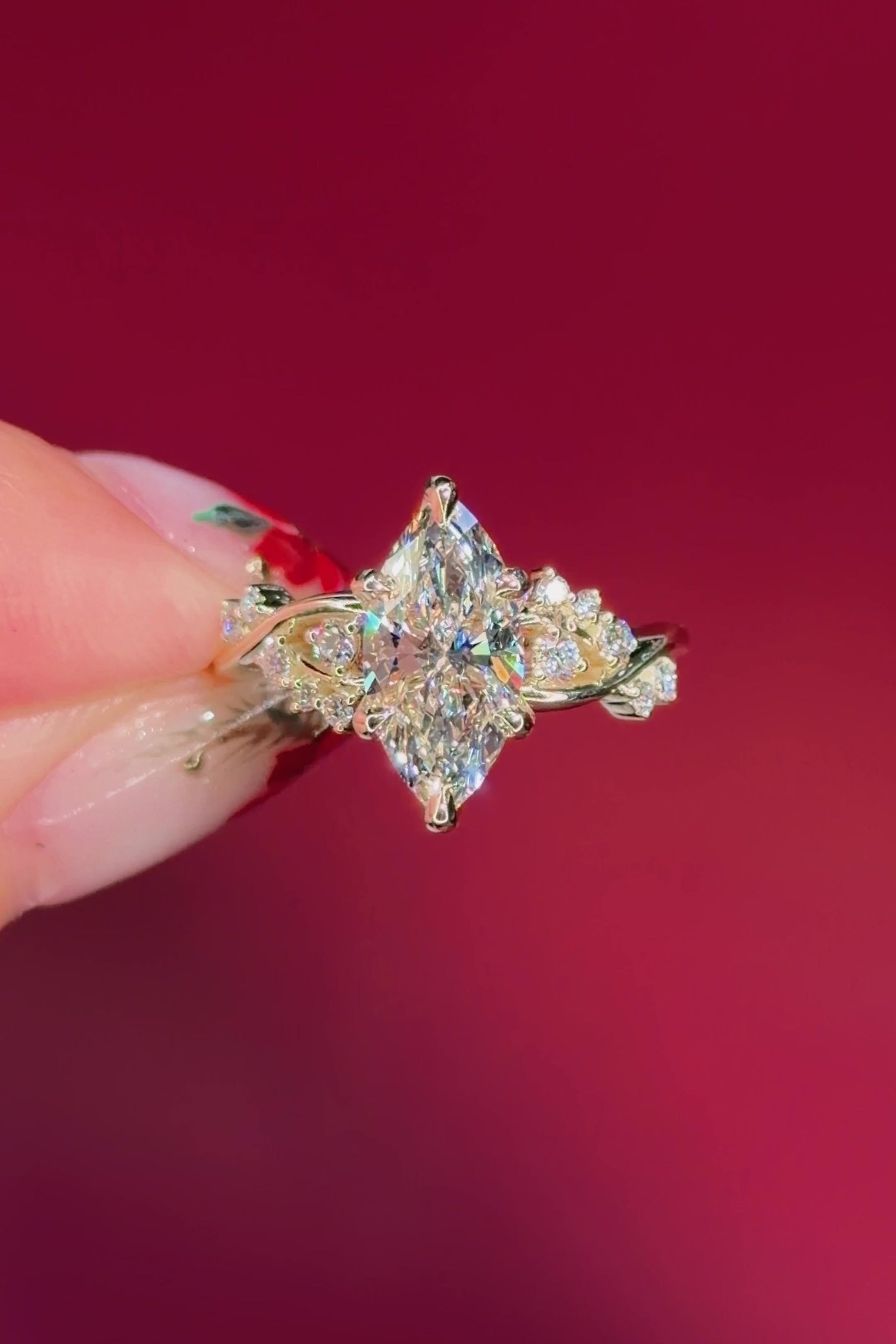 marquise diamond yellow gold engagement ring with alternating side stones