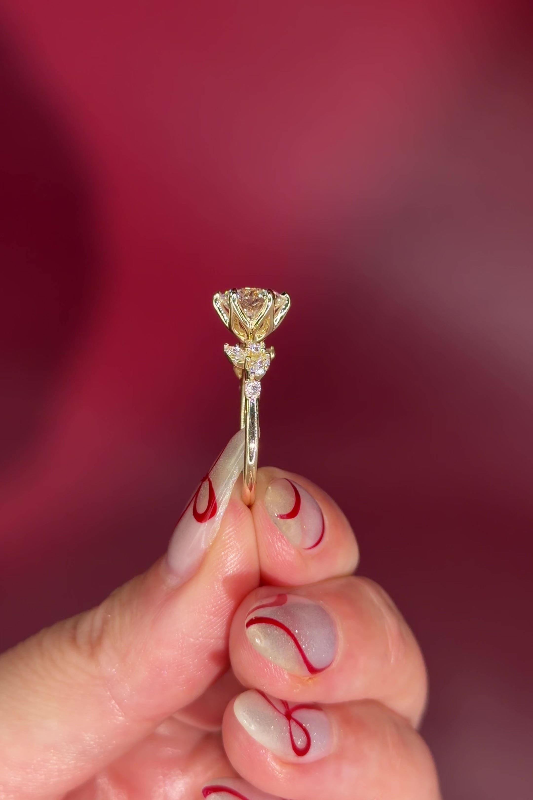 Round Diamond Engagement Ring with Nature Inspired Marquise side diamonds and petal prongs