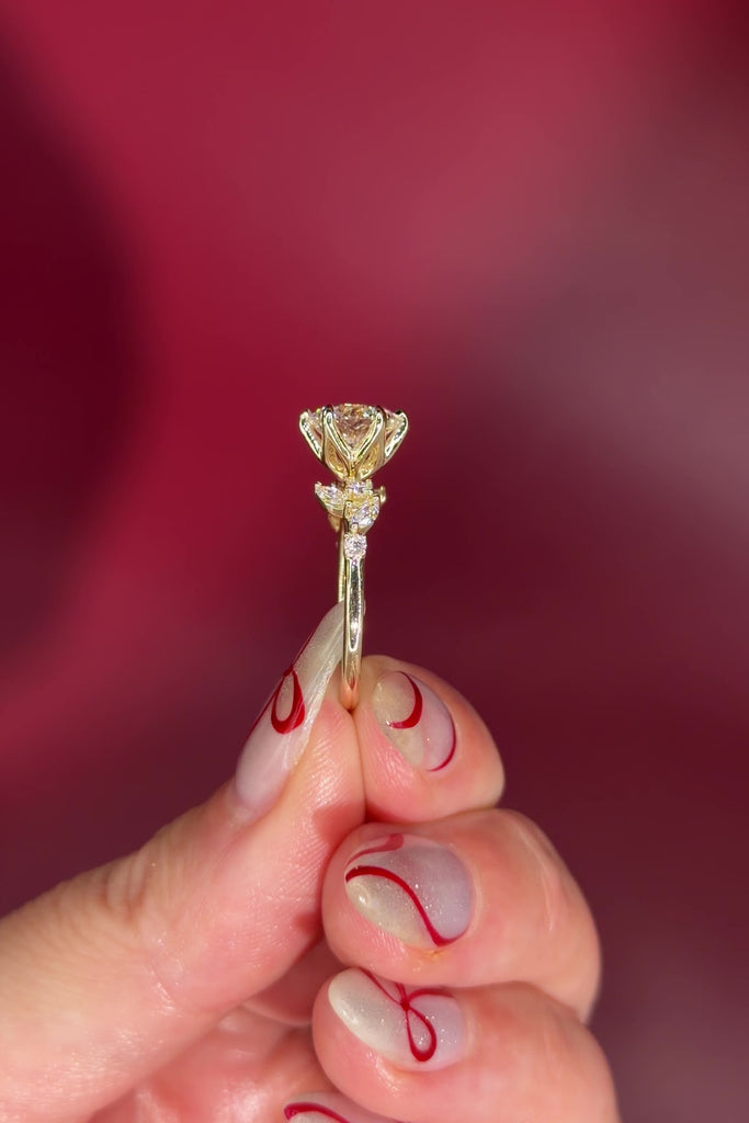 Round Diamond Engagement Ring with Nature Inspired Marquise side diamonds and petal prongs