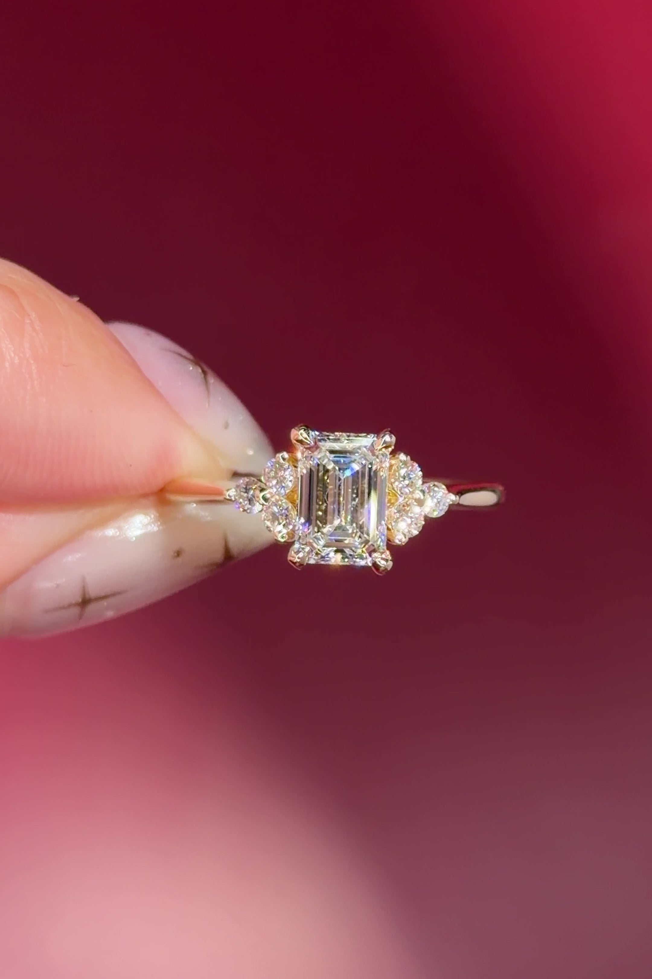 emerald lab diamond engagement ring trio side stone cluster yellow gold