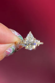 pear lab diamond cluster side stone setting nature inspired engagement ring yellow gold