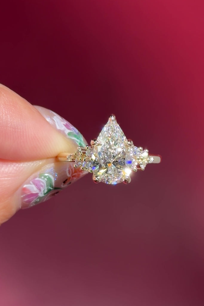 pear lab diamond cluster side stone setting nature inspired engagement ring yellow gold
