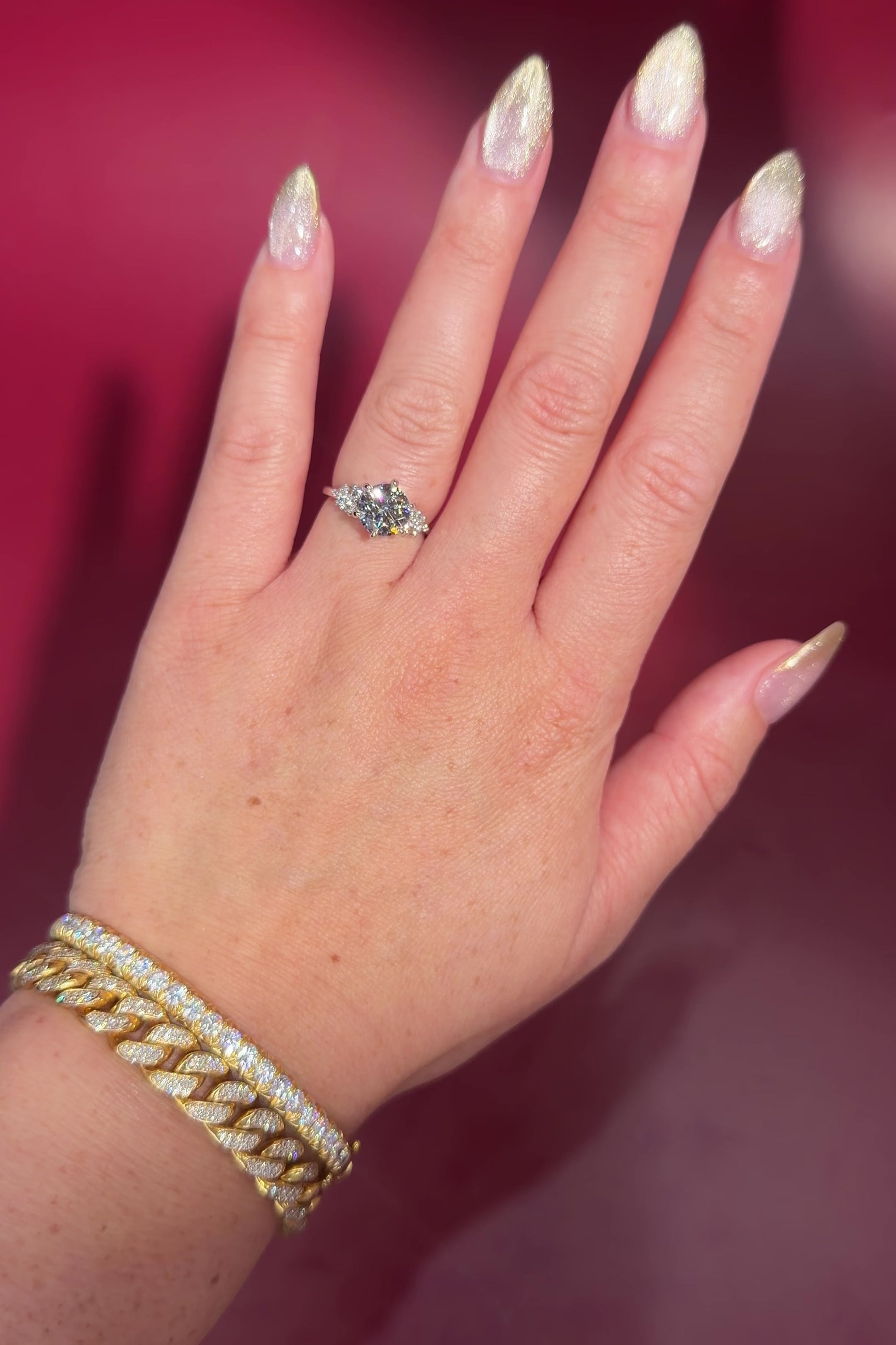 2.00ct D-VVS1 Round Lab Diamond Nova. This is a traditional body engagement ring featuring organic cluster side diamonds that resemble star dust or baby's breath. The center stone is held by our signature petal prongs.