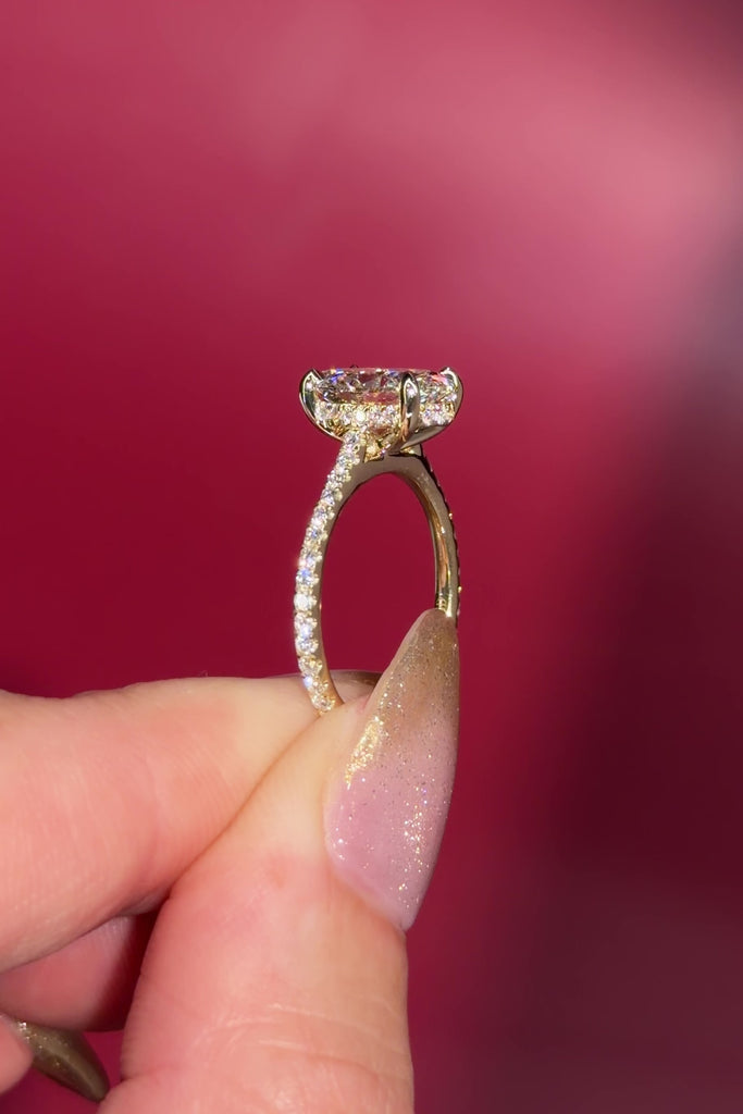 2.06ct D-VS1 Oval Lab Diamond Michelle. Cathedral style engagement ring with pavé diamonds going 75% around the ring, hidden halo, and high polish plain bridge made in solid 14k yellow gold.