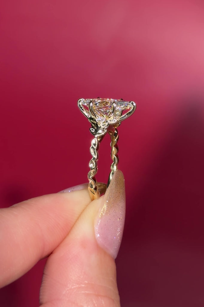 2.09ct D-VVS2 Marquise Lab Diamond Arwen. Nature inspired engagement ring with organic leaves made of gold going up the band to hold the center stone with petal prongs.