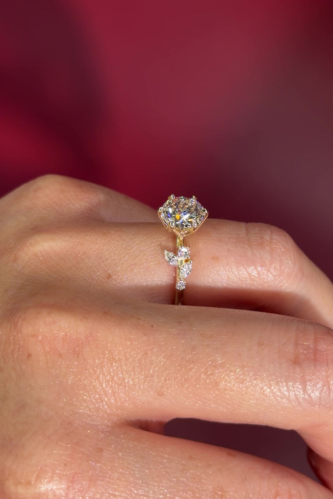 Round Diamond Engagement Ring with Nature Inspired Marquise side diamonds and petal prongs