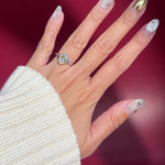 oval lab diamond white gold solitaire split shank engagement ring on hand