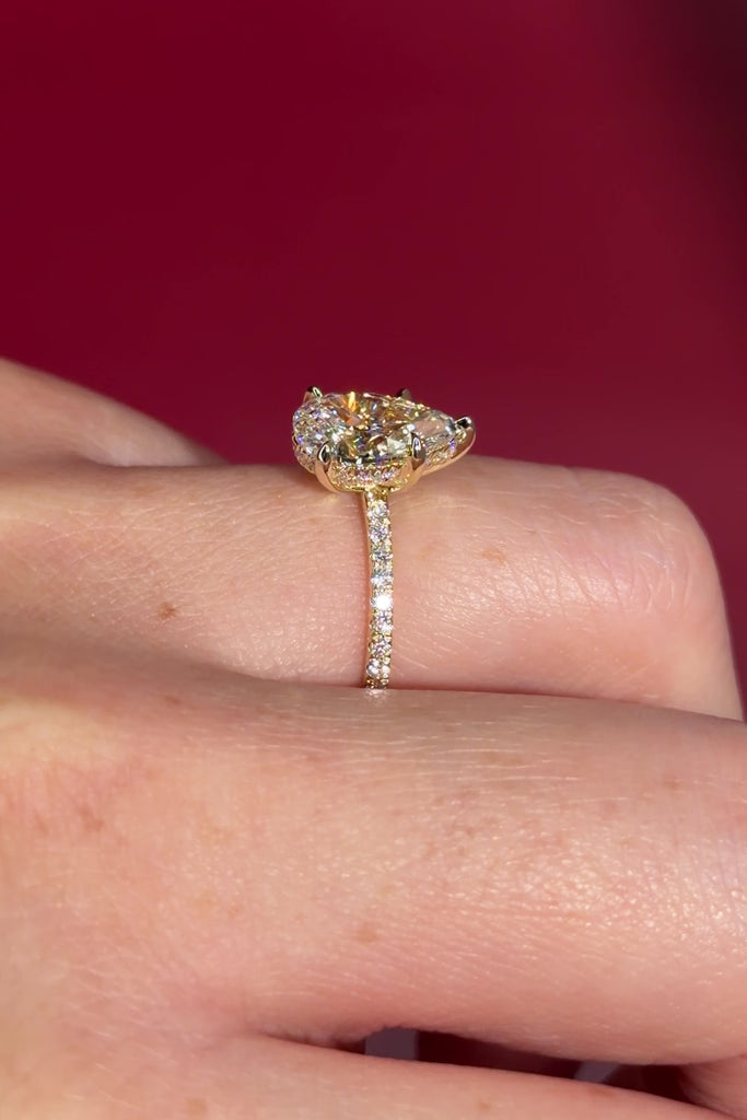 &nbsp;2.00ct D-VVS1 Pear Lab Diamond Kayla. The Kayla is a traditional style body engagement ring with a hidden halo that goes between the prongs, she showcases a classic comfort-fit band, subtly complemented by pave diamonds set on the band.