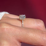 round lab diamond yellow gold engagement ring pavé with cathedral and diamond bridge and diamond prongs on hand