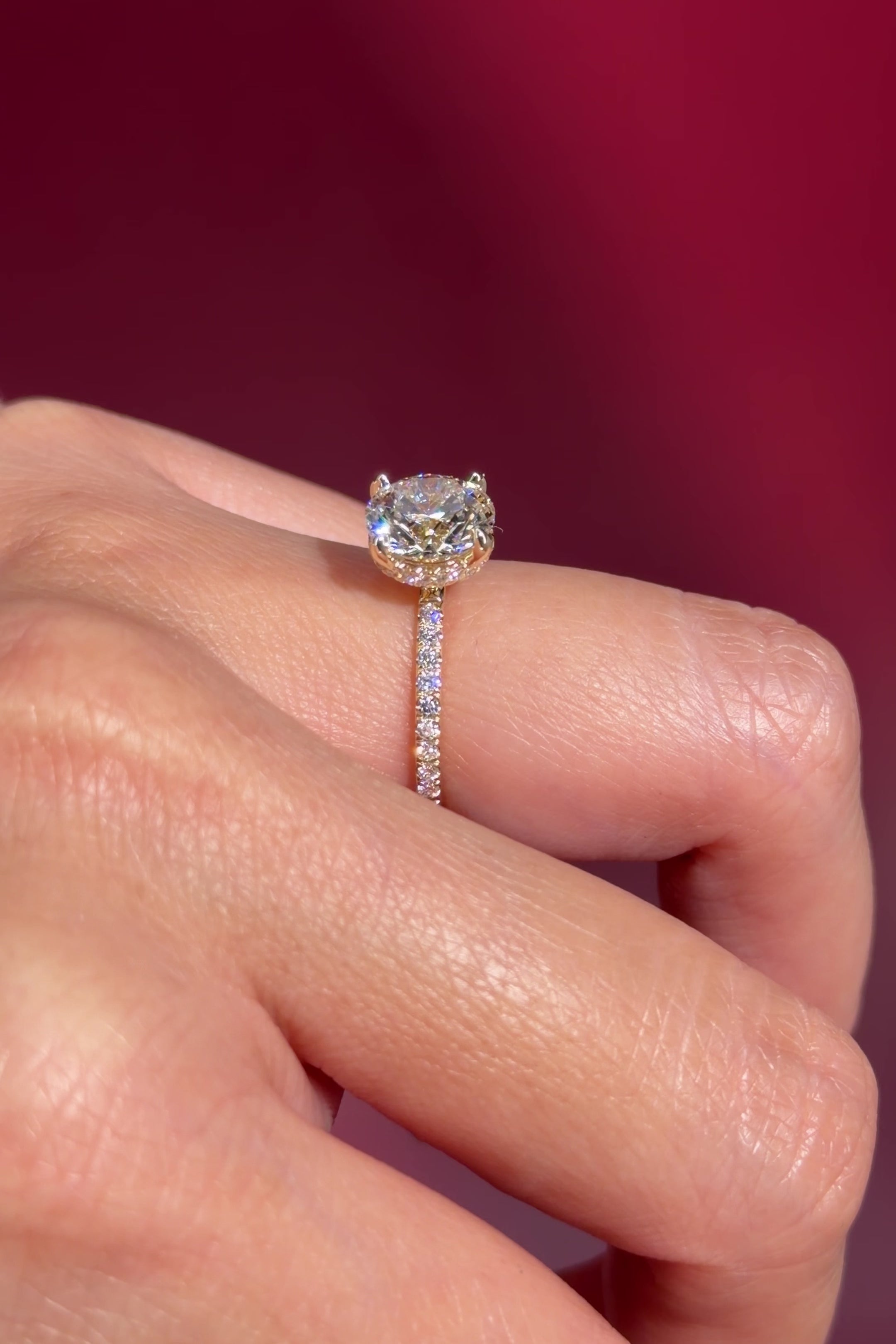 round lab diamond engagement ring yellow gold pavé diamonds with hidden halo on hand