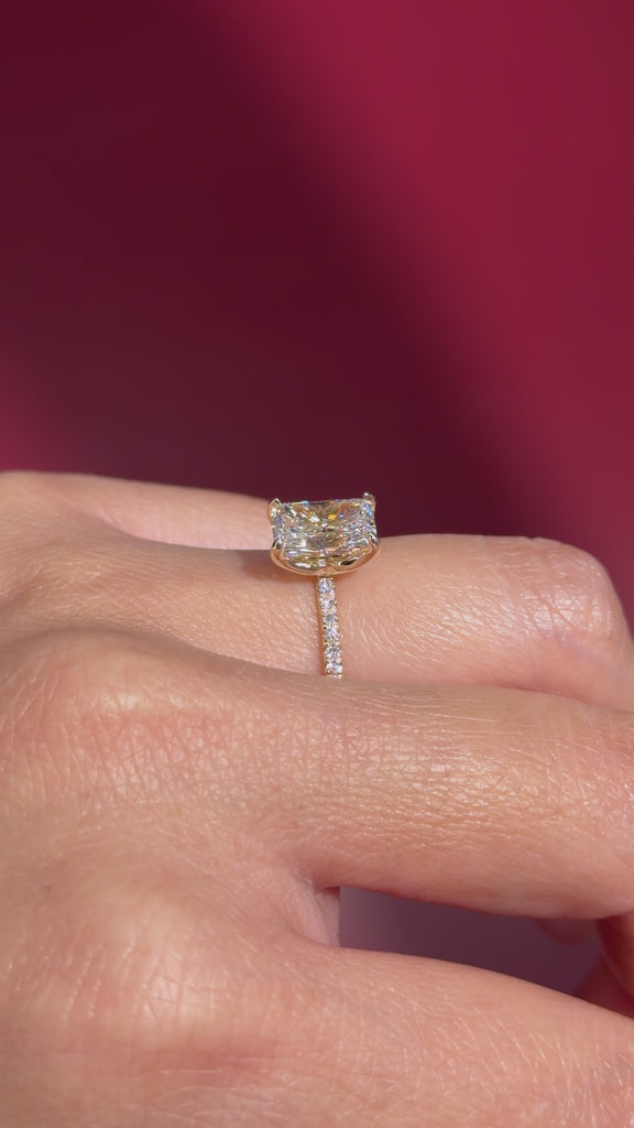 radiant lab diamond yellow gold pave engagement ring flower petal prong basket on hand