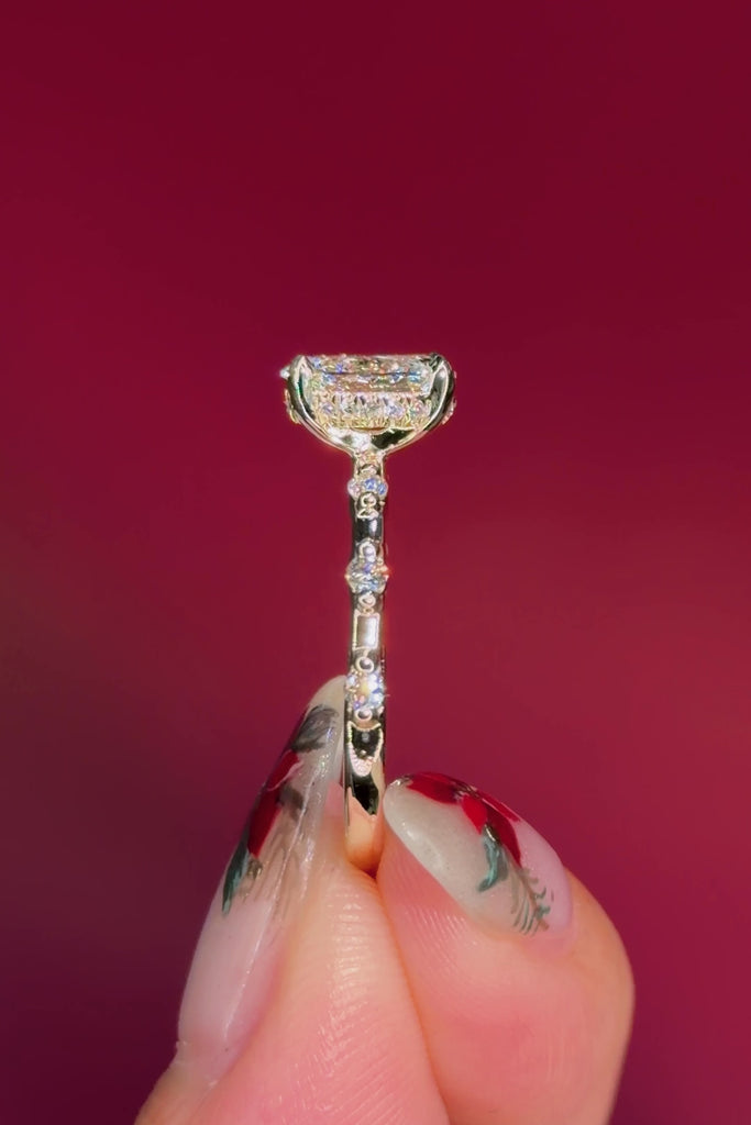 oval floating diamond spaced out band yellow gold engagement ring