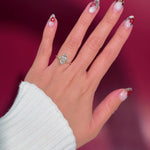 marquise yellow gold engagement ring with pear side stones on hand