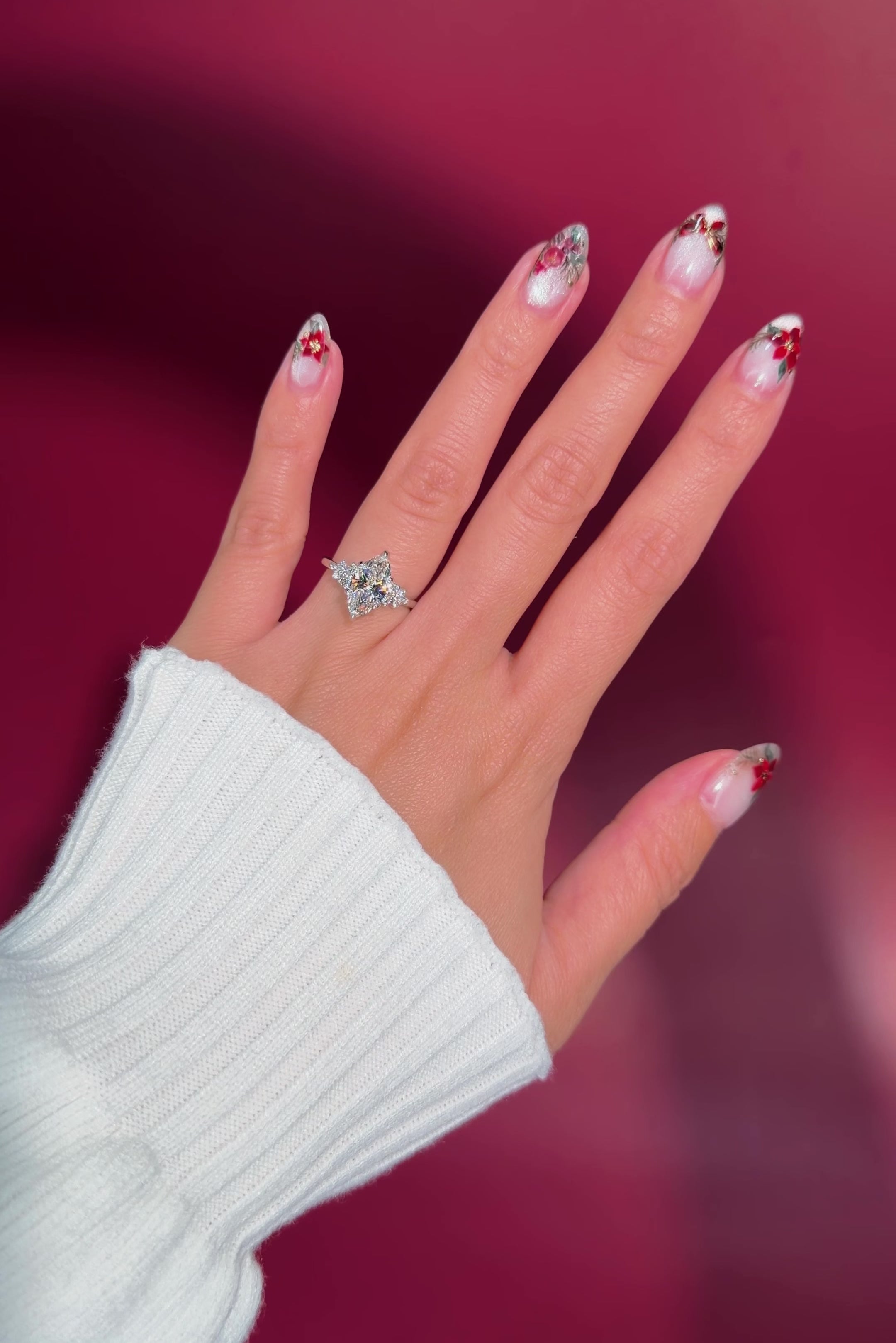 marquise diamond cluster white gold engagement ring on hand