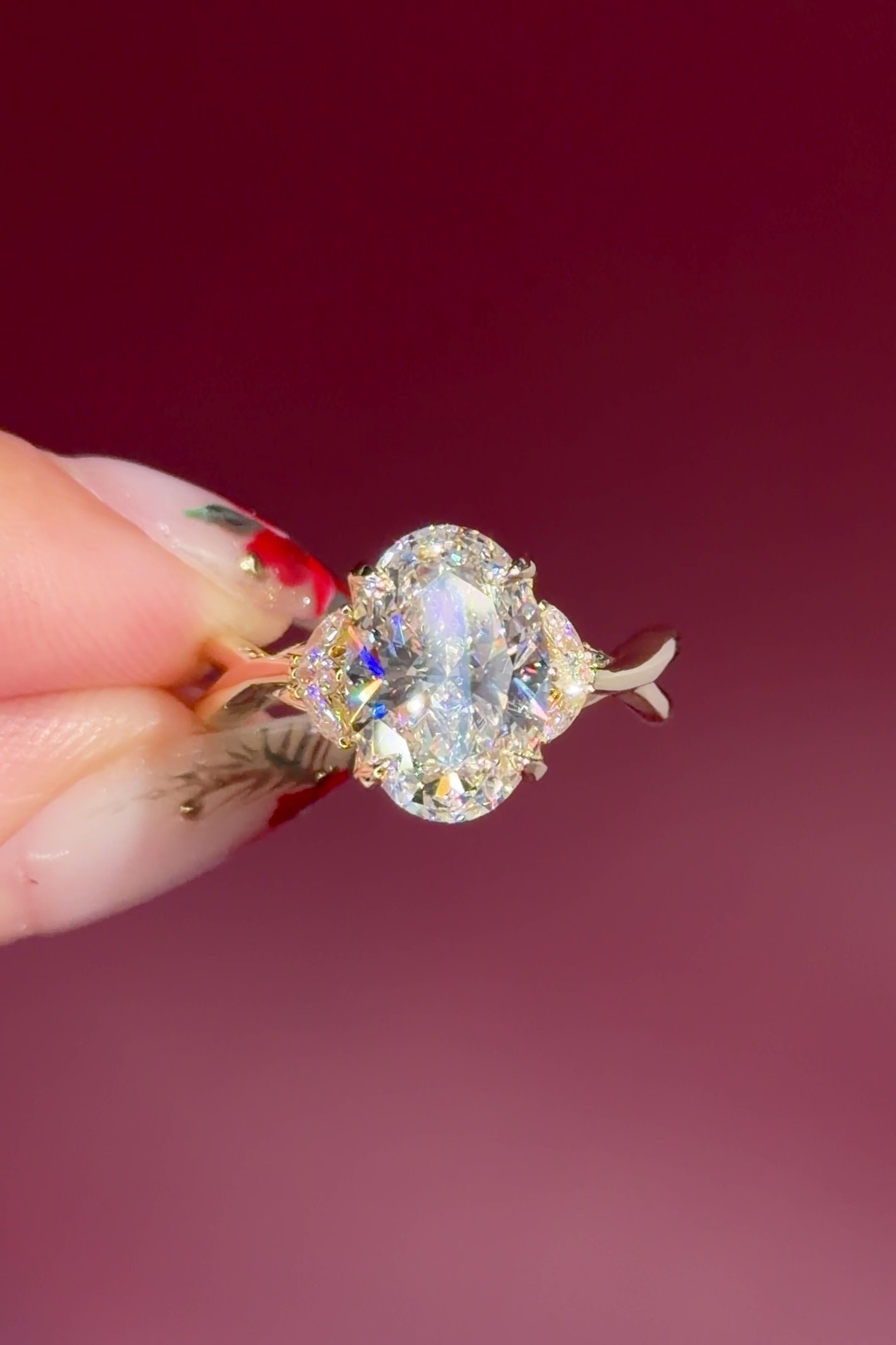 oval lab diamond nature inspired twist band engagement ring yellow gold cluster side stone setting