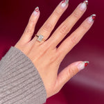 radiant lab diamond yellow gold solitaire engagement ring cathedral setting with diamond bridge on hand