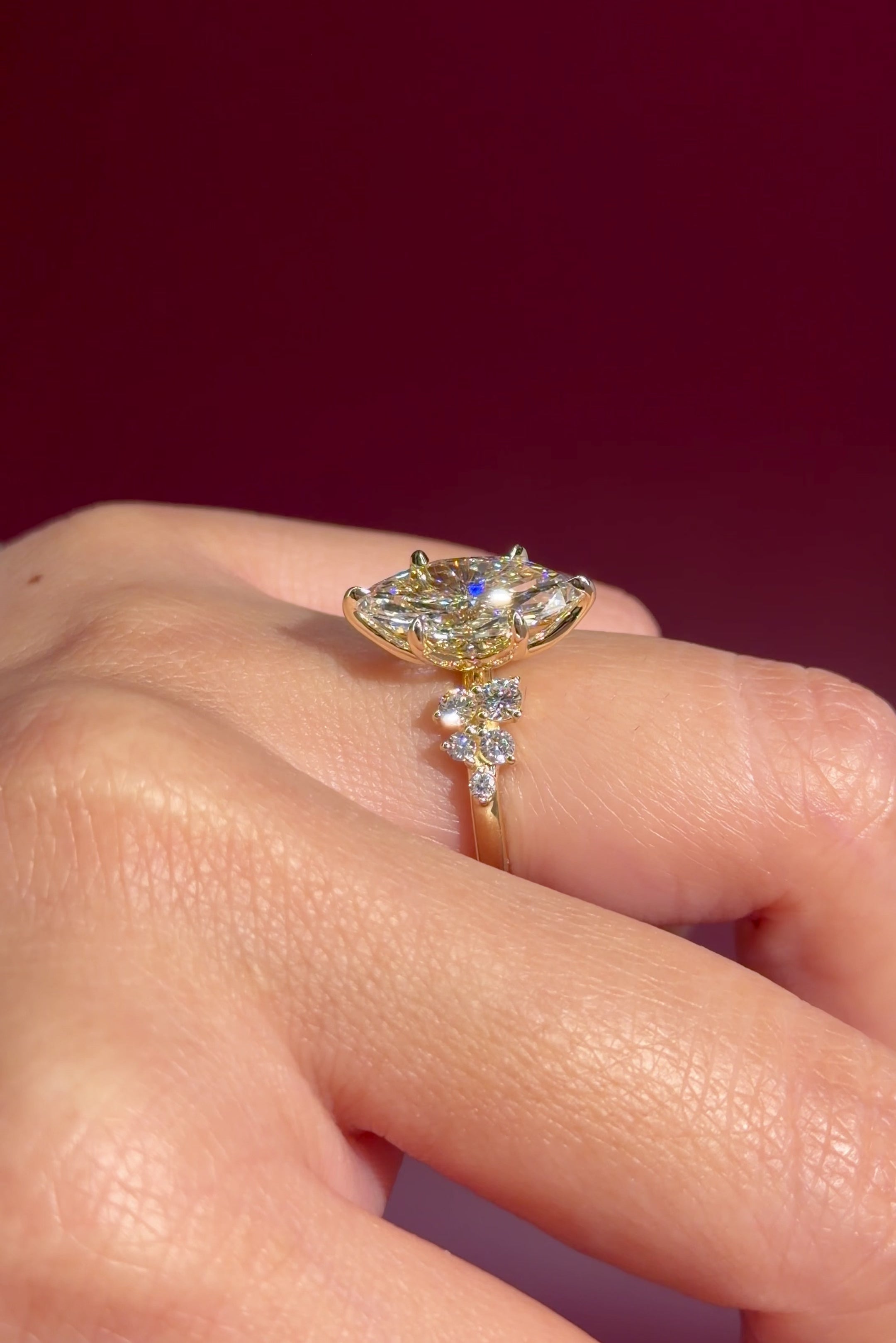 marquise lab diamond engagement ring yellow gold cluster side stones setting on hand