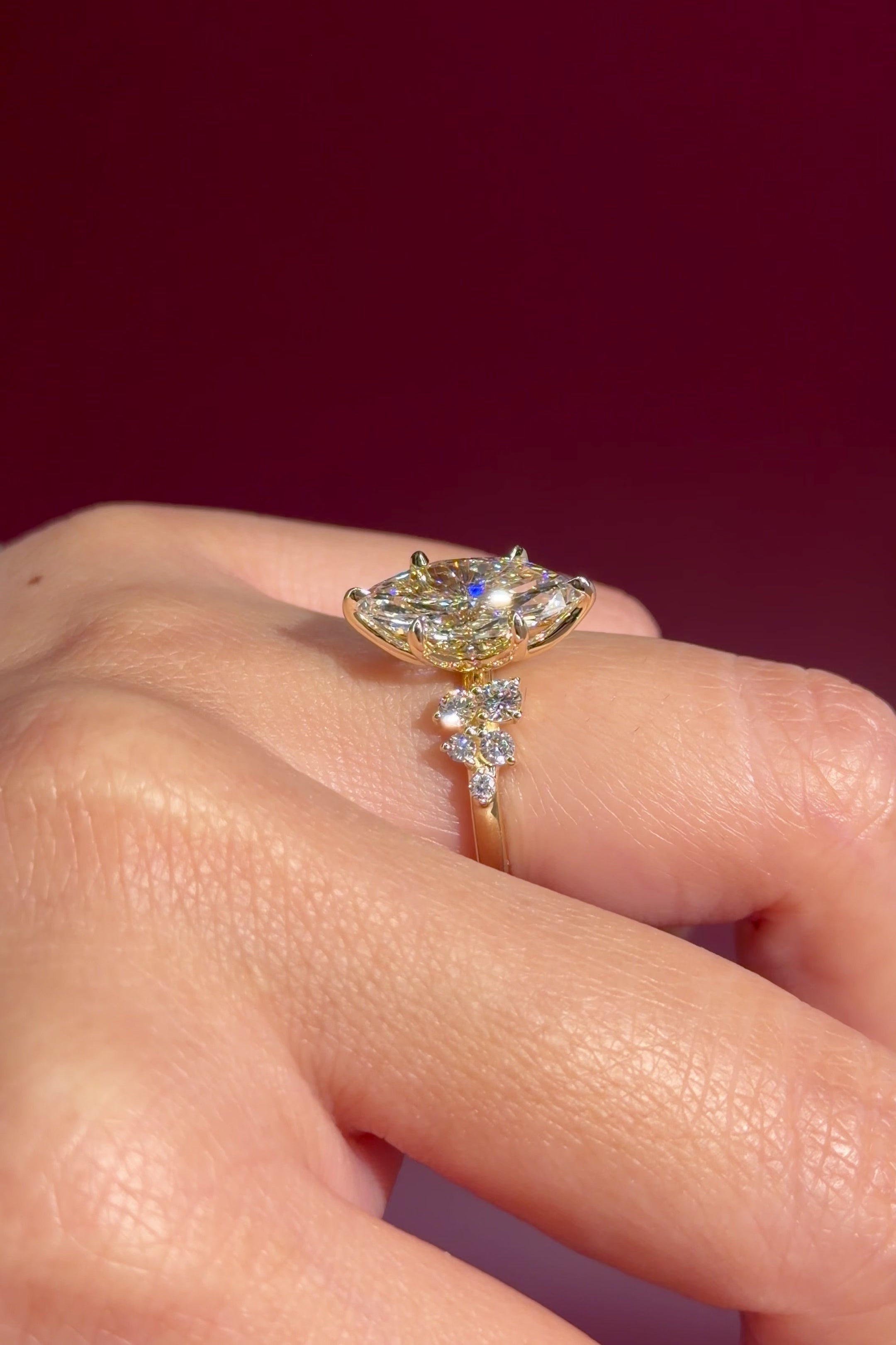 marquise lab diamond engagement ring yellow gold cluster side stones setting on hand