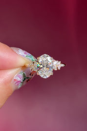 oval lab diamond engagement ring side stone cluster nature inspired yellow gold setting with petal prong basket