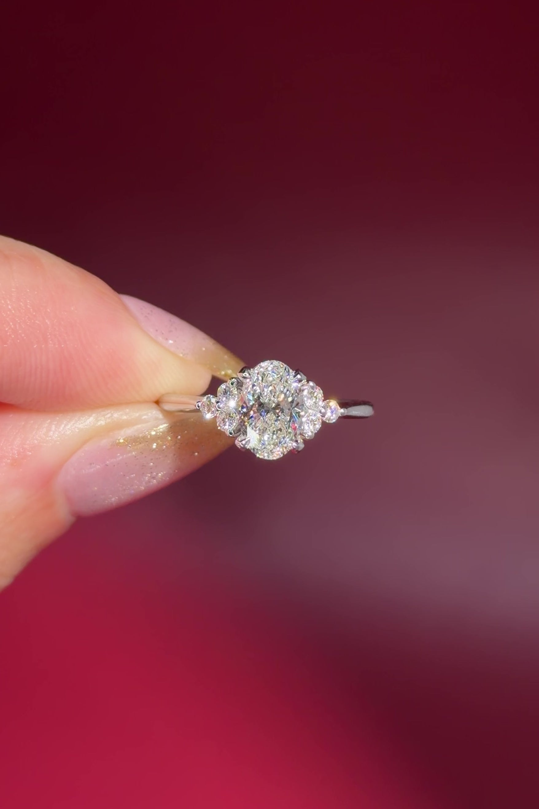 1.01ct D-VS1 Oval Lab Diamond Lindsey. The Lindsey features a classic high polish band with a trio of diamond side stones to perfectly accent your selected center stone.