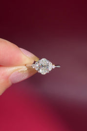 1.01ct D-VS1 Oval Lab Diamond Lindsey. The Lindsey features a classic high polish band with a trio of diamond side stones to perfectly accent your selected center stone.