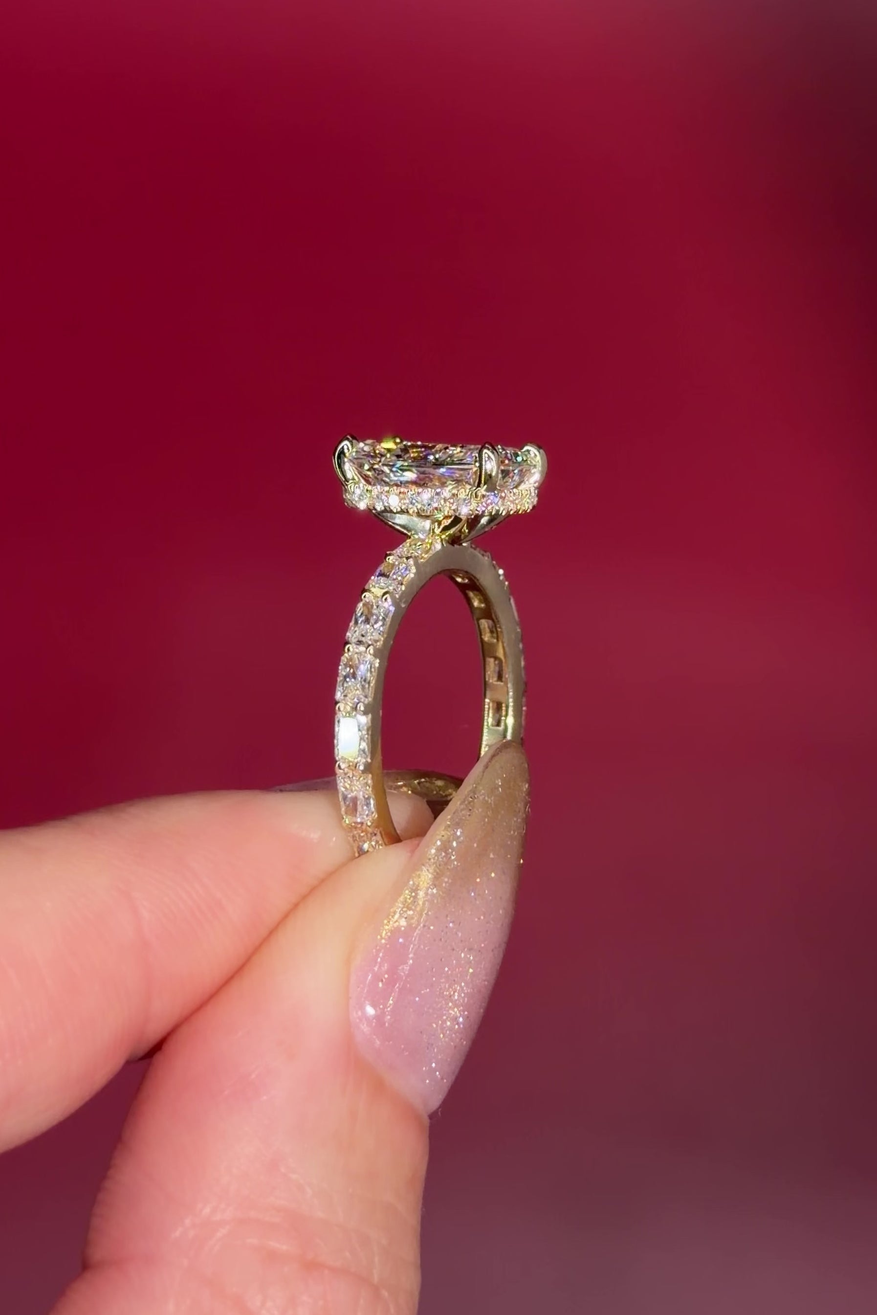 2.74ct E-VS1 Radiant Lab Diamond East West Ring. This is a traditional style engagement ring featuring a wrap under halo and east west radiant cut lab diamonds set into the band. The entire ring is made in solid 14k yellow gold.