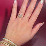 3.07ct F-VVS2 Radiant Lab Diamond Isabela. The Isabela is a cathedral style body with the key features being the pavé diamond lotus petal prongs and diamond bridge. This specific isabela is made with pavé side diamonds and is solid 14k yellow gold.