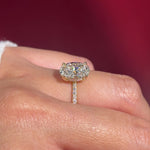 oval lab diamond engagement ring pavé band with diamond prongs and hidden halo on hand