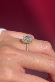 oval lab diamond engagement ring pavé band with diamond prongs and hidden halo on hand