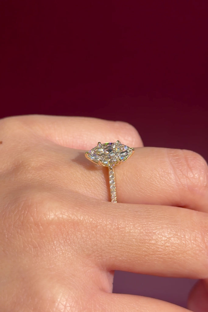 marquise lab diamond engagement ring yellow gold pave diamond band cathedral setting on hand