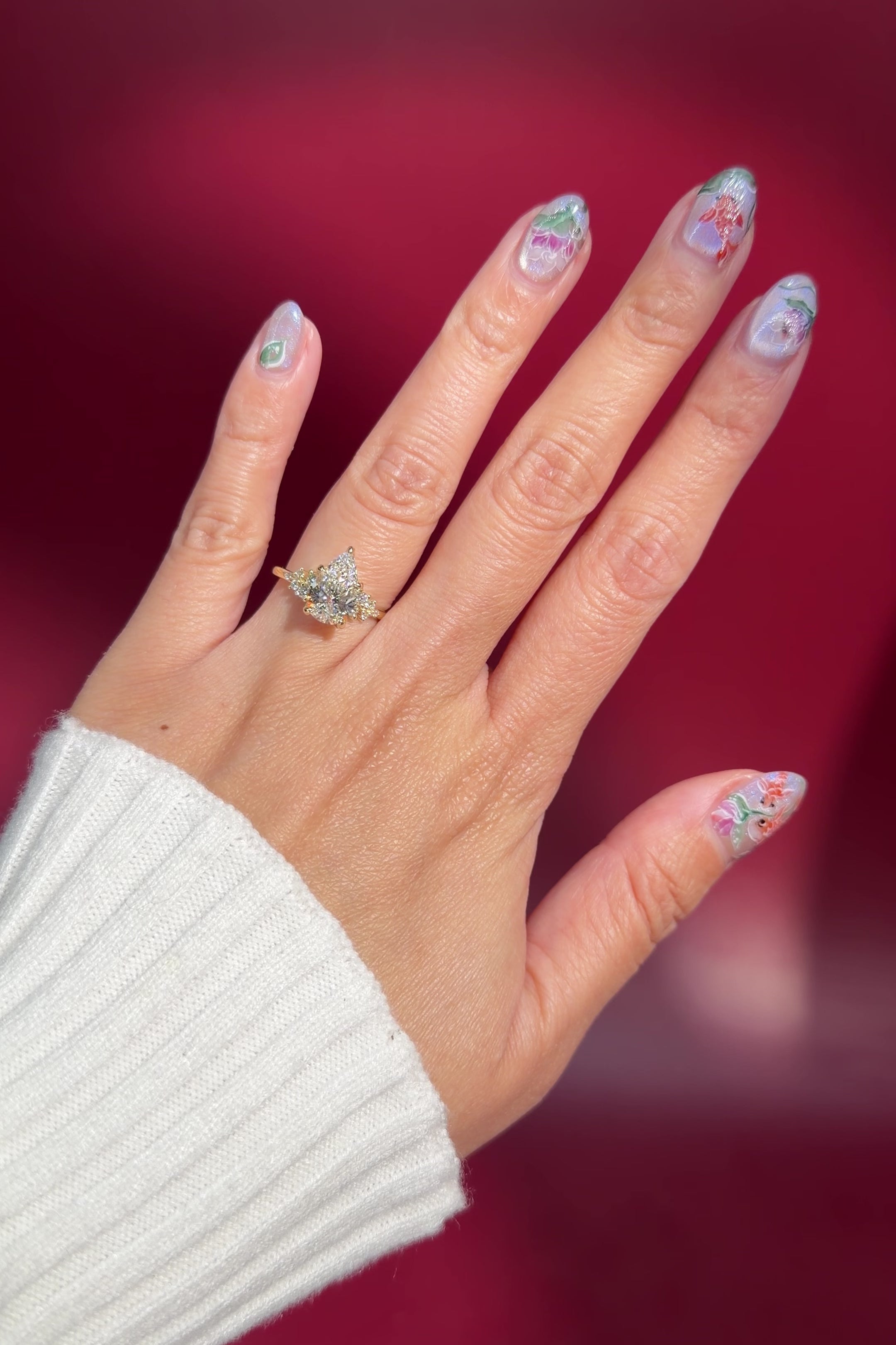 pear lab diamond cluster side stone setting nature inspired engagement ring yellow gold on hand