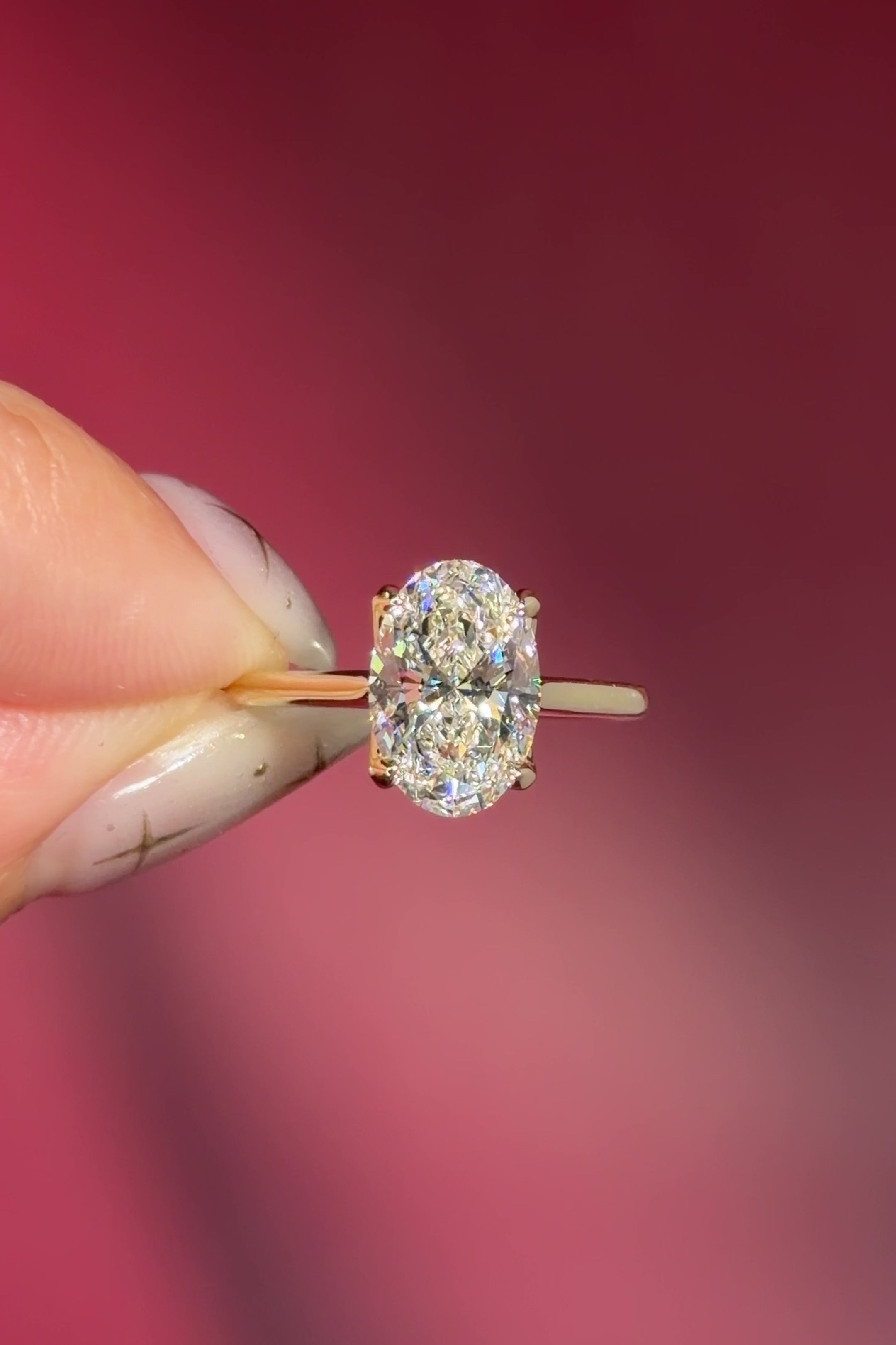 classic oval lab diamond solitaire engagement ring yellow gold cathedral setting petal prong basket