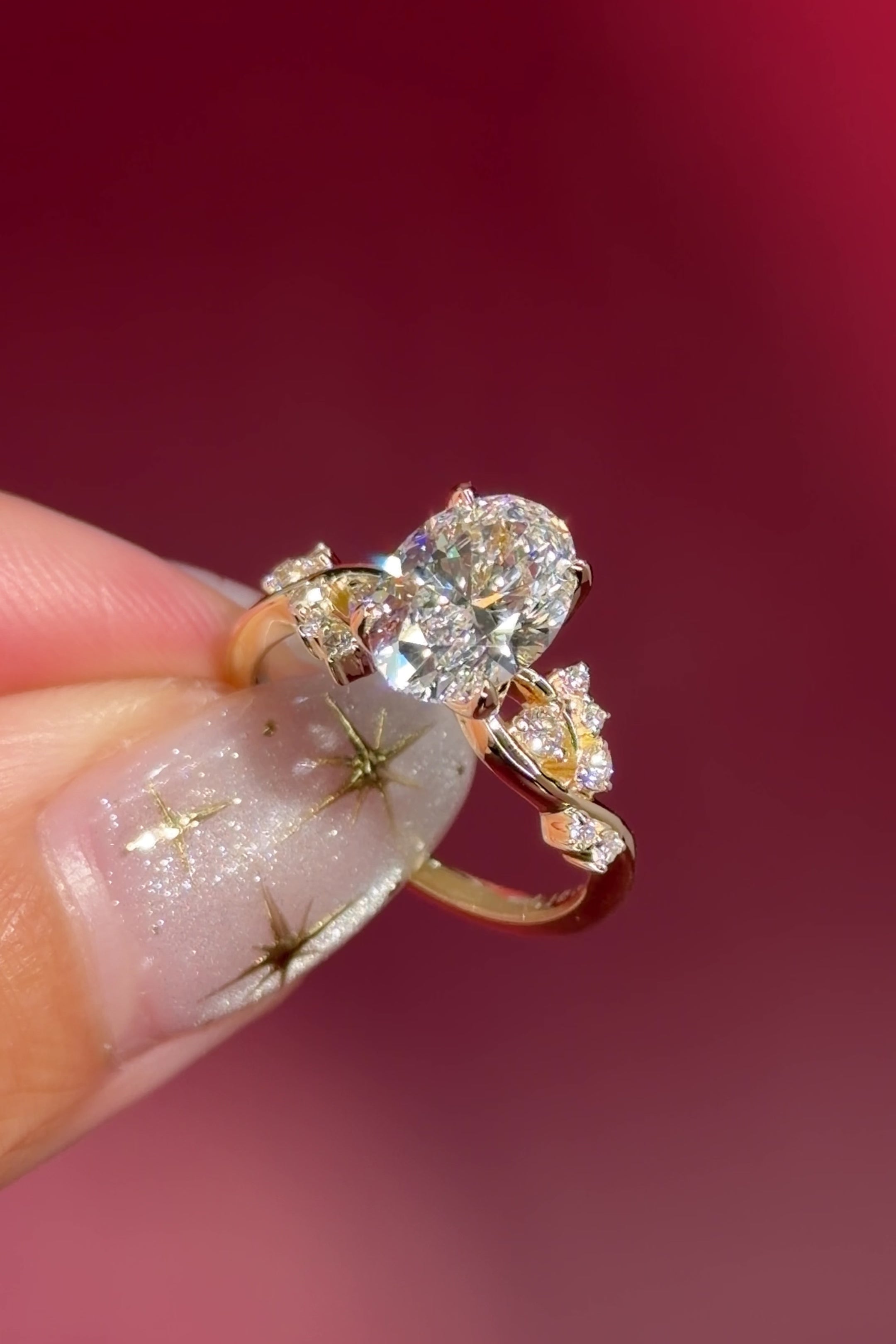 oval lab diamond cluster side stones whimsical yellow gold engagement ring