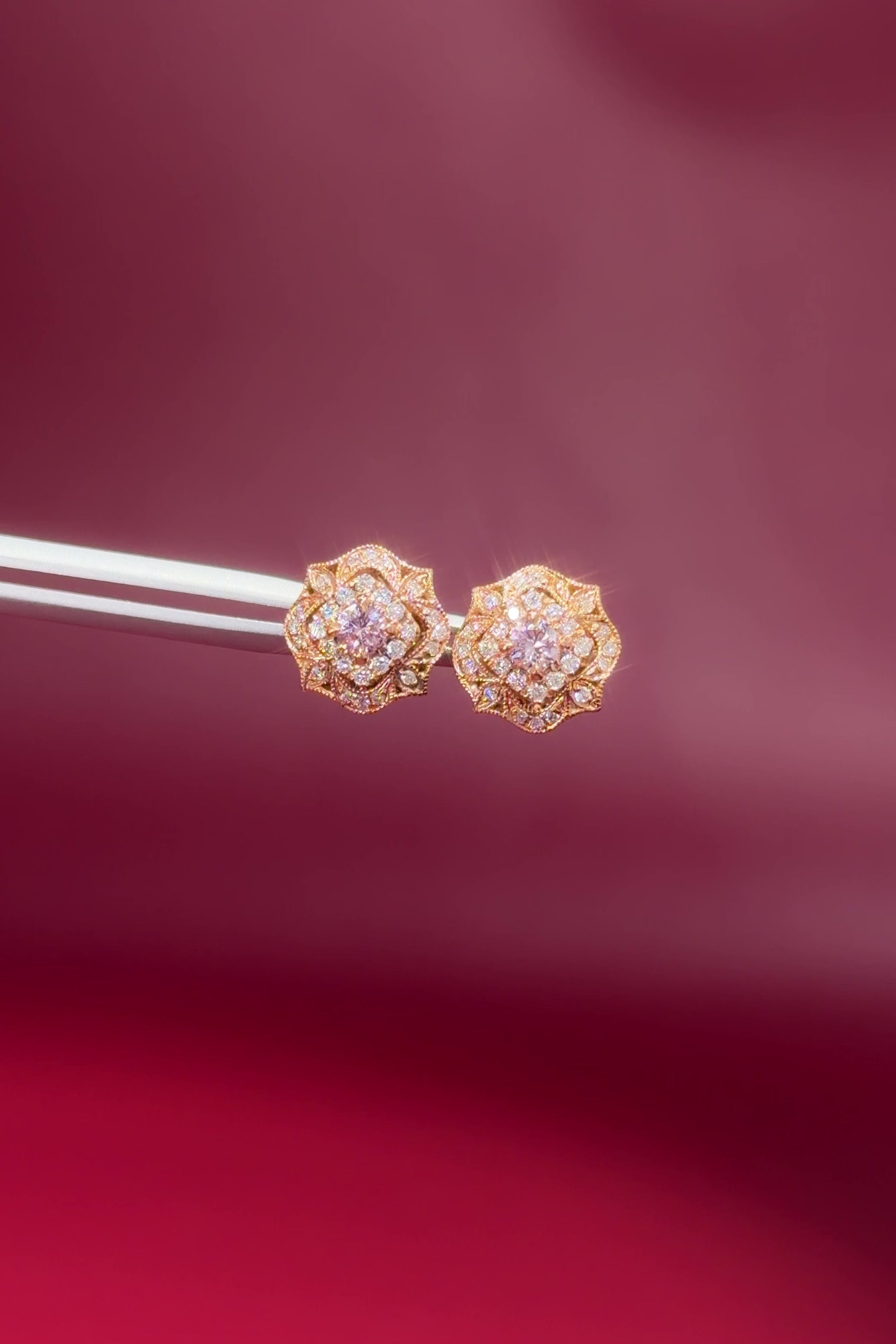 Pink Diamond Claire stud earrings in 14k rose gold with natural pink diamonds and a white diamond halo at Princess Bride Diamonds jewelry store in Orange County video 