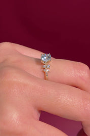 round yellow gold cluster petal prong engagement ring on hand