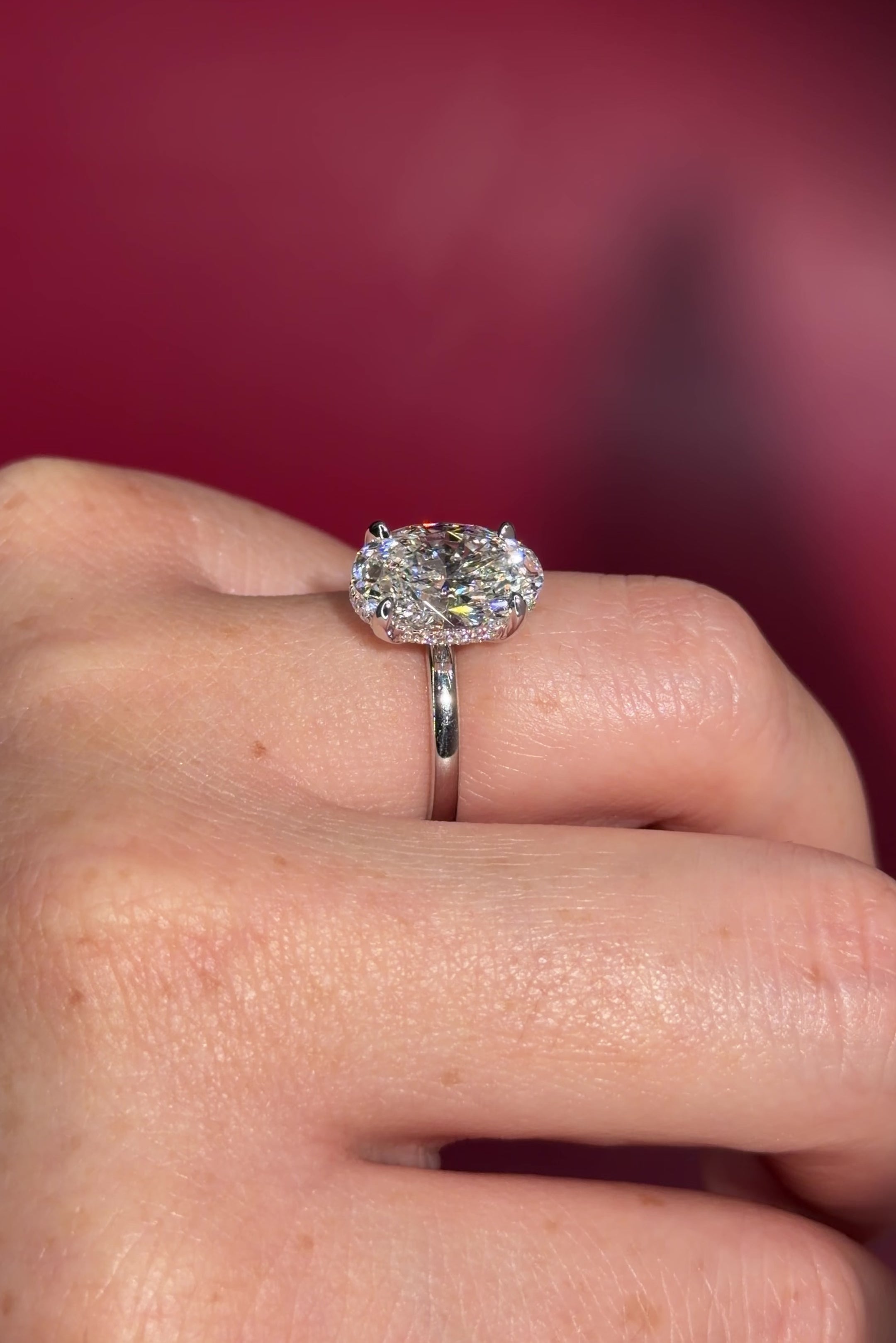 4.07ct D-VS1 Oval Lab Diamond Kayla Oval lab diamond solitaire in white gold with a wrap under halo and high polish plain band.