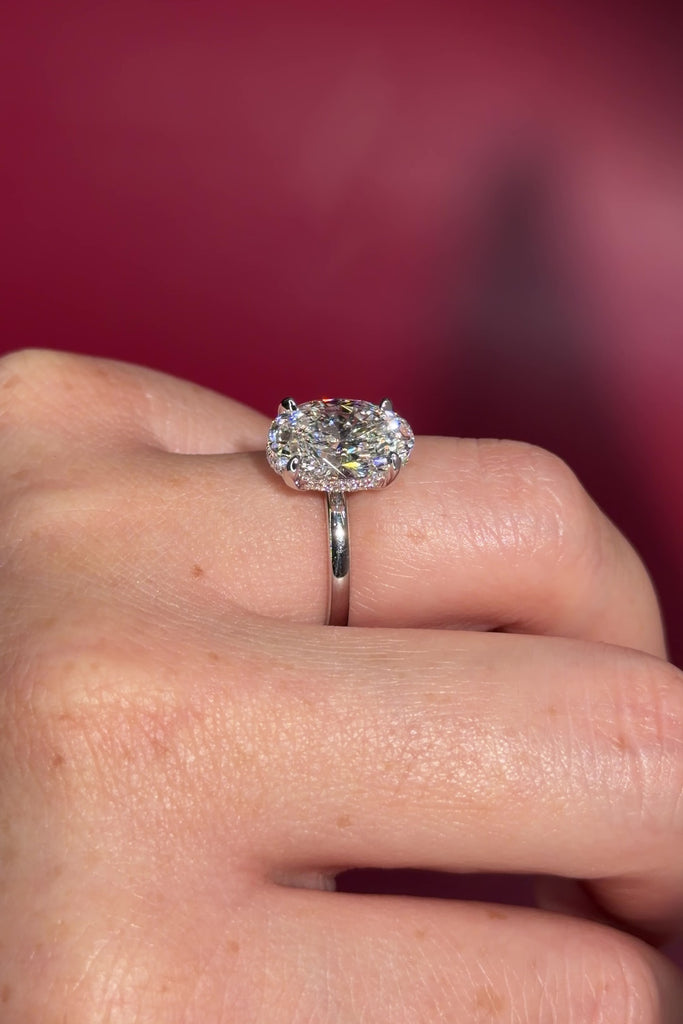 4.07ct D-VS1 Oval Lab Diamond Kayla Oval lab diamond solitaire in white gold with a wrap under halo and high polish plain band.