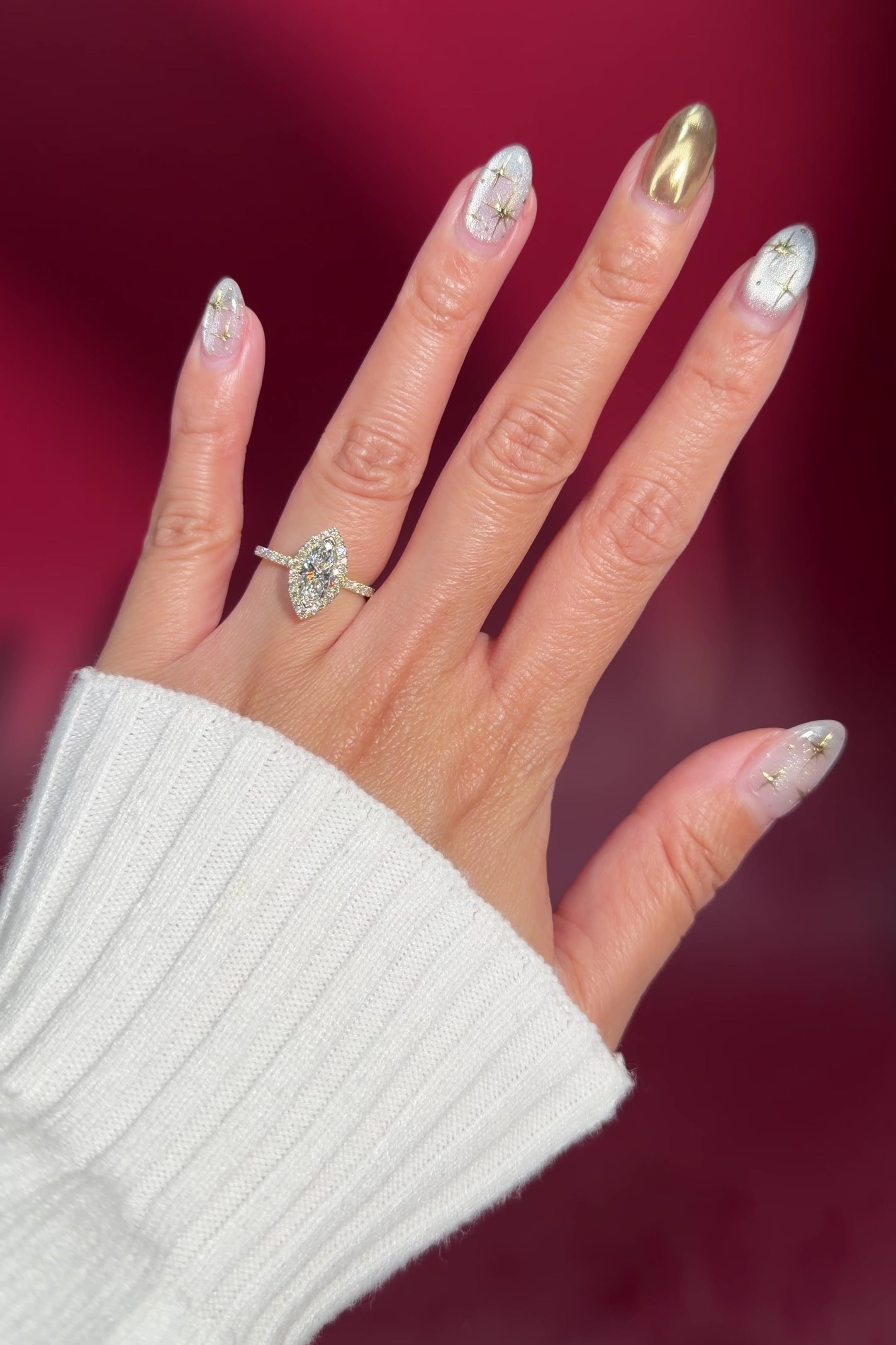 marquise lab diamond halo engagement ring with diamond petal prong basket on hand