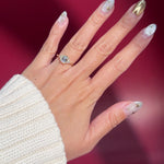 emerald lab diamond engagement ring trio side stone cluster yellow gold on hand