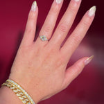 1.01ct D-VS1 Oval Lab Diamond Lindsey. The Lindsey features a classic high polish band with a trio of diamond side stones to perfectly accent your selected center stone.