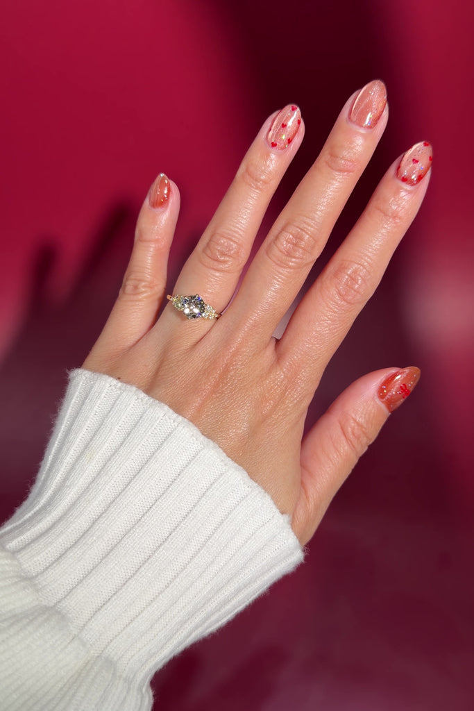 1.53ct round lab diamond engagement ring side stone cluster whimsical nature inspired flower petal prong basket on hand