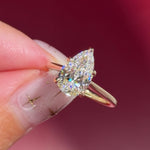 pear lab diamond solitaire engagement ring with cathedral and belt