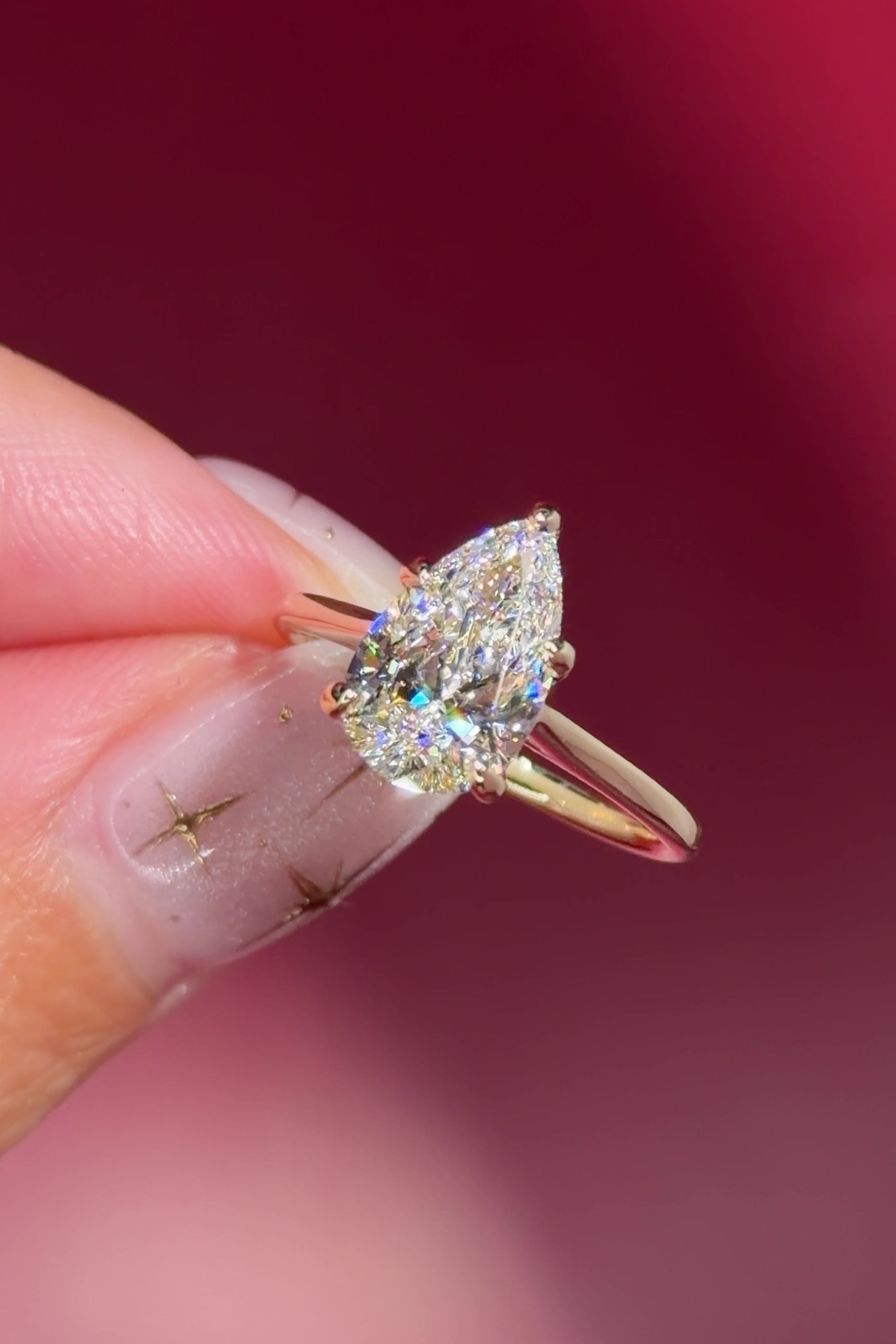 pear lab diamond solitaire engagement ring with cathedral and belt